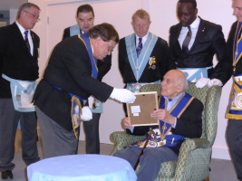 Neville Jacobs receiving his 50 year certificate in 2014